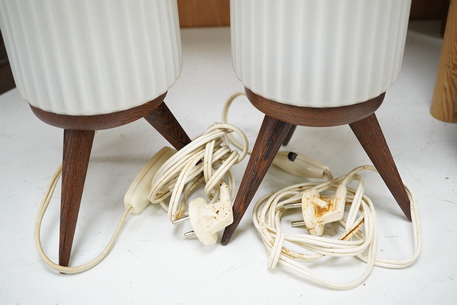 A pair of mid century modernist ribbed frosted glass shaded table lamps on three wooden tripod legs. 36cm high. Condition - good